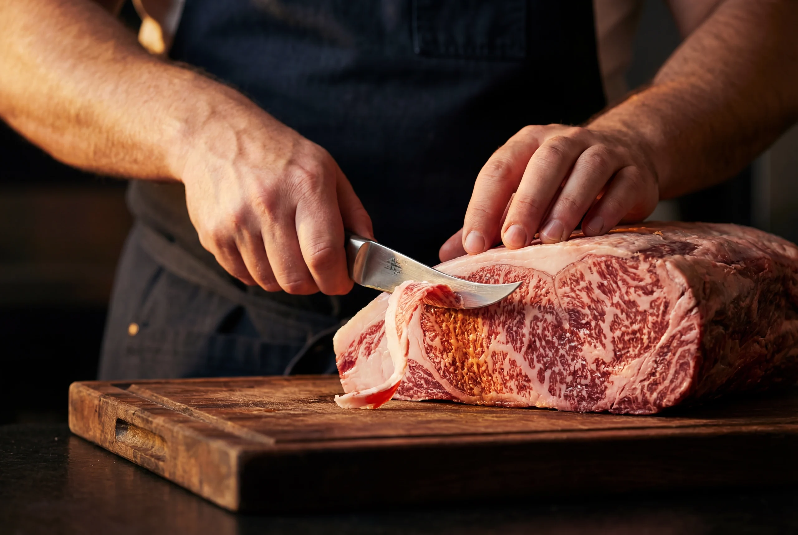 Akaushi ribeye searing on a cast iron skillet